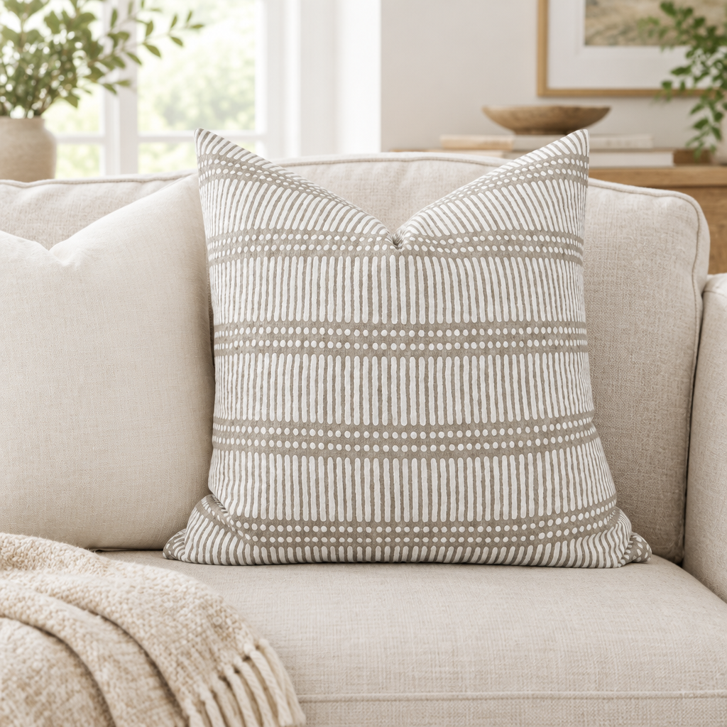 Dash Dot linen pillow cover on a neutral sofa in a bright living room